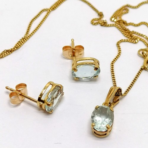 287 - 9ct marked gold aquamarine pendant on gold 44cm chain t/w matching earrings - total weight 1.8g