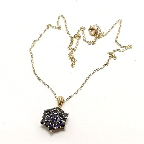 292 - 9ct hallmarked gold purple stone (tanzanite?) cluster pendant on gold 38cm chain - 1.9g total weight