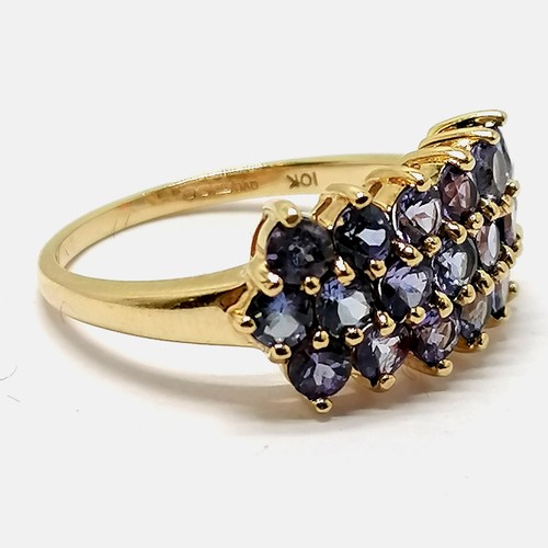 296 - 9ct hallmarked gold purple stone (tanzanite?) cluster ring - size P & 3.6g total weight