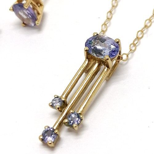 298 - 9ct marked gold purple stone (tanzanite?) pendant on 9ct 38cm chain t/w matching 9ct gold earrings -... 