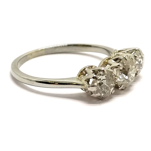 354 - Unmarked 18ct white gold 3 stone diamond ring (largest stone 5mm diameter) - size K & 2.5g