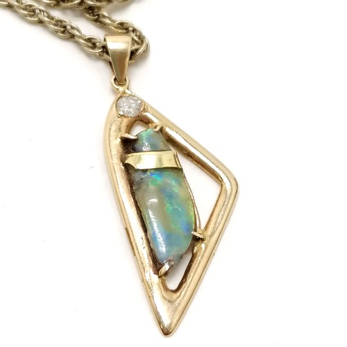 417 - 14ct (585) marked gold pendant set with raw uncut opal & diamond on a 56cm silver gilt rope chain ~ ... 