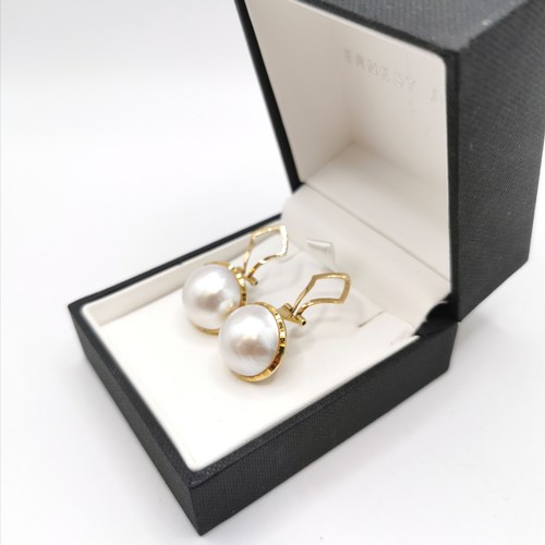 447 - 18ct marked gold mabe pearl (approx 14.5mm diameter) earrings - total weight 10.2g