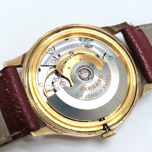 463 - 9ct gold cased Garrards of London automatic watch with date aperture (32mm case) in original retail ... 