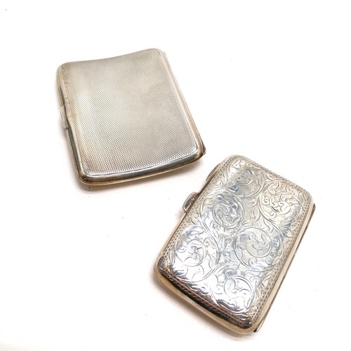 482 - 2 x antique sterling silver cigarette cases - largest 8cm x 6cm & is engine turned with slight dents... 