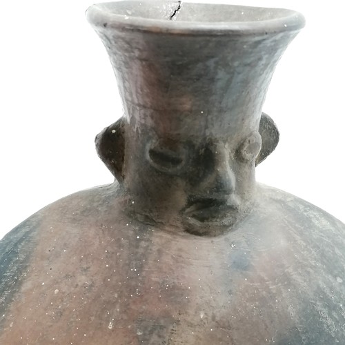 29 - Pre-columbian pottery vessel with handle & face detail to neck - 26cm high x 20cm across ~ has repai... 