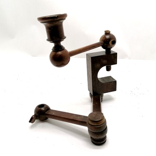 67 - Antique walnut table clamp with candlestick attachment 20cm high.