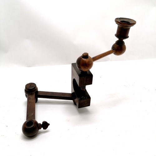 67 - Antique walnut table clamp with candlestick attachment 20cm high.