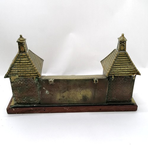 68 - Antique brass desk stand in the form of a chateau, with 2 inkwells and a stamps box. Mounted on a ma... 