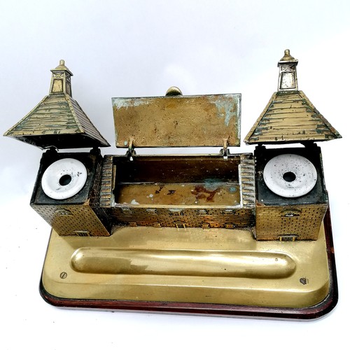 68 - Antique brass desk stand in the form of a chateau, with 2 inkwells and a stamps box. Mounted on a ma... 