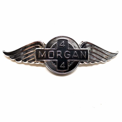 85 - Morgan winged 4/4 car badge (15cm) t/w Morgan tankard (some dents), Morgan related books / magazines... 