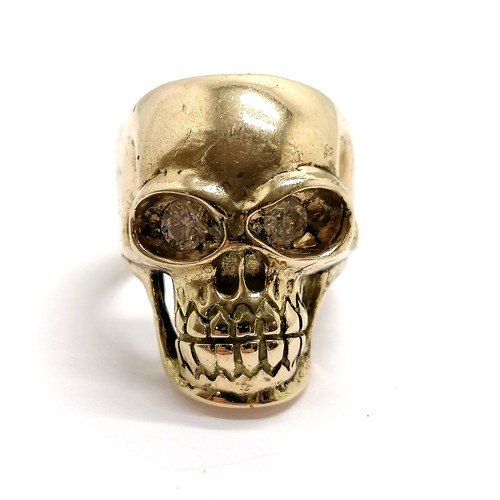 105 - 9ct marked gold skull ring engraved 'Or Glory' on the shank & set with 2 x diamond eyes ~ size V½ & ... 