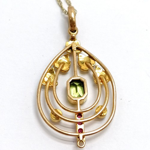 111 - Antique 9ct marked gold Art Nouveau pendant set with peridot / ruby / pearl (3.5cm drop and missing ... 