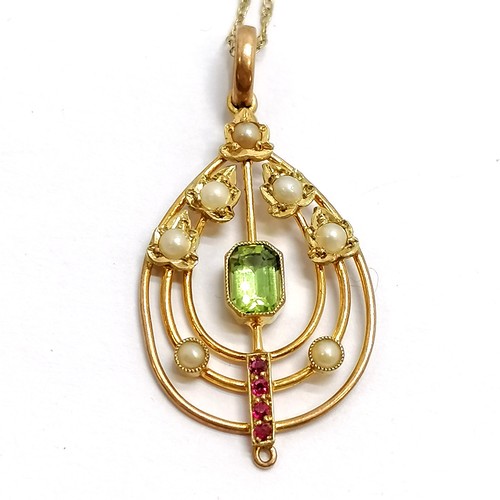 111 - Antique 9ct marked gold Art Nouveau pendant set with peridot / ruby / pearl (3.5cm drop and missing ... 