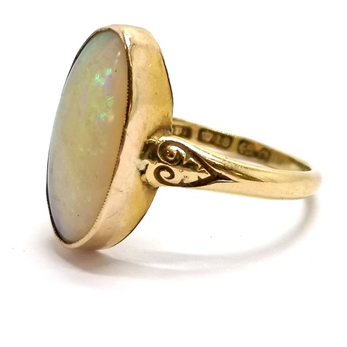 121 - 18ct hallmarked gold opal ring - size Q & 3.6g total weight ~ slight marks to stone