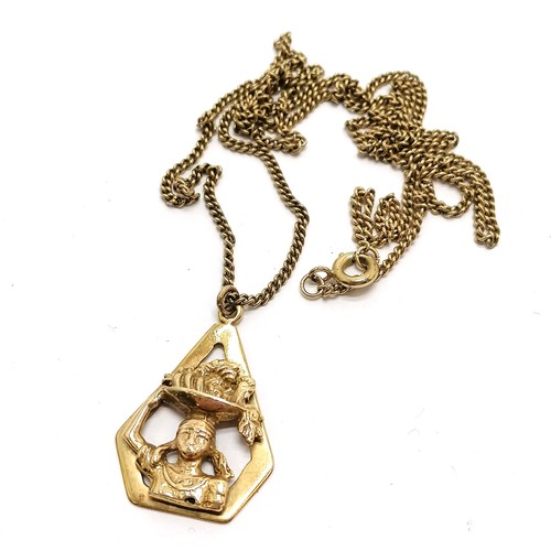 136 - Unmarked gold ethnic pendant on 9ct marked gold 62cm chain - 13.2g - SOLD ON BEHALF OF THE NEW BREAS... 