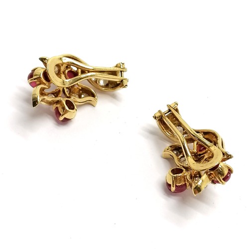 147 - Pair of unmarked 18ct gold clip-on earrings set with cabochon rubies & diamonds - 2.5cm drop & 9g to... 