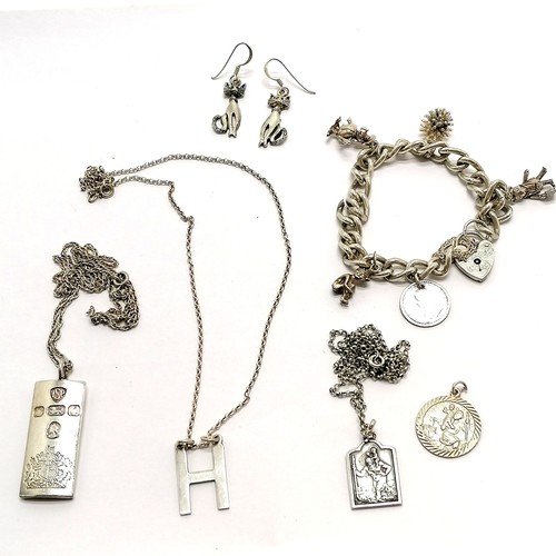 161 - Qty of silver jewellery ~ ½oz ingot on 50cm chain, charm bracelet + charms, 2 x St Christophers (1 o... 