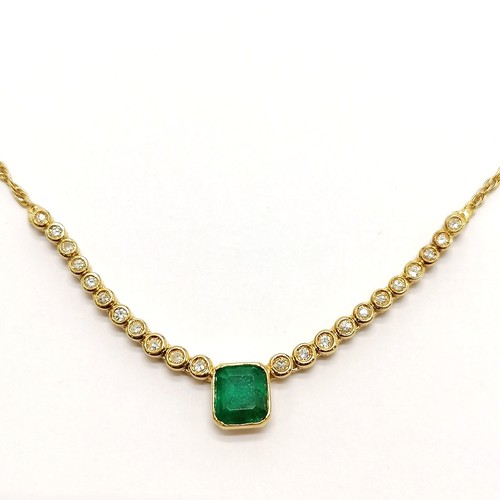 204 - 18ct hallmarked gold necklace set with emerald (approx 7.5mm x 6.5mm) & diamonds (22) - 44cm long & ... 