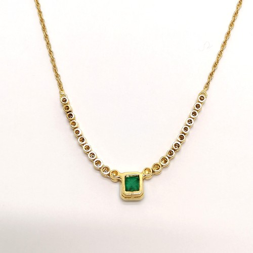 204 - 18ct hallmarked gold necklace set with emerald (approx 7.5mm x 6.5mm) & diamonds (22) - 44cm long & ... 