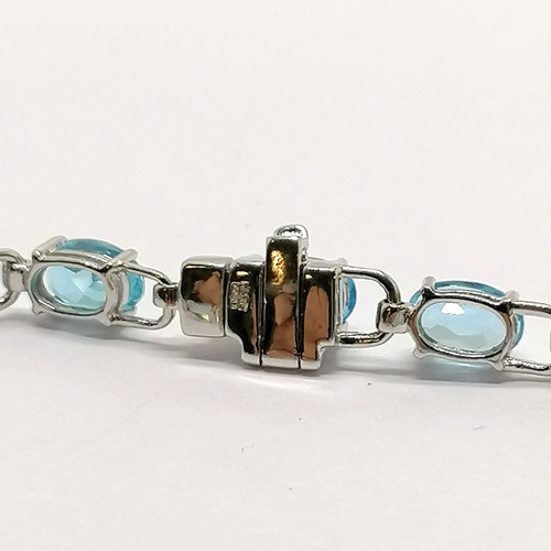 208 - 18ct marked white gold blue topaz stone set bracelet - 17cm & 7.7g total weight