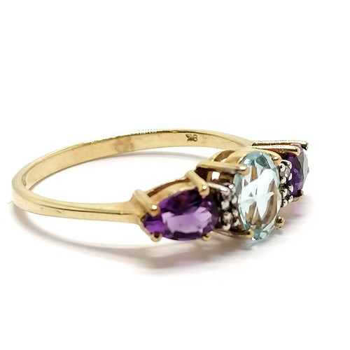 211 - 9ct hallmarked gold blue topaz, amethyst & diamond set ring - size R & 2.2g total weight