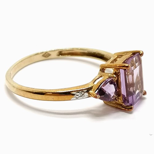 213 - 9ct marked gold amethyst (rectangular + 2 trillion cut) ring with diamond set shoulders - size P½ & ... 