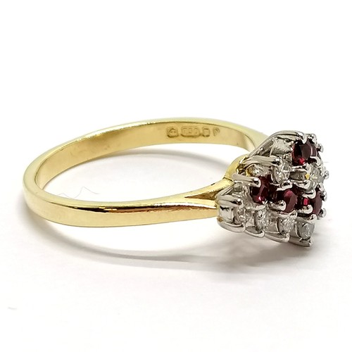 224 - 18ct hallmarked gold ruby & diamond set cluster ring - size N & 3.6g total weight