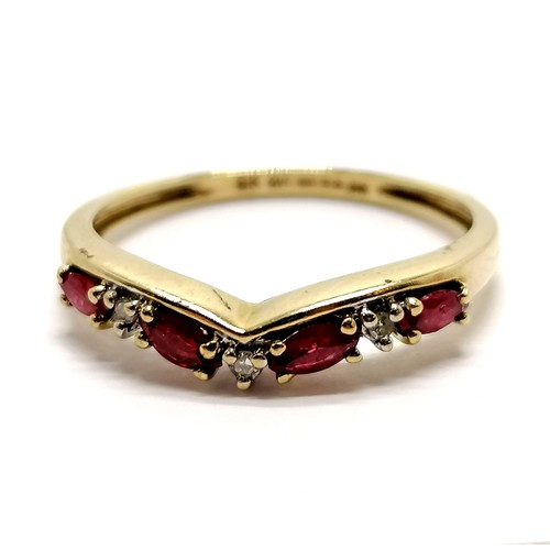 228 - 9ct hallmarked gold ruby & diamond wishbone shaped ring - size P & 1.5g total weight ~ note 1 side o... 