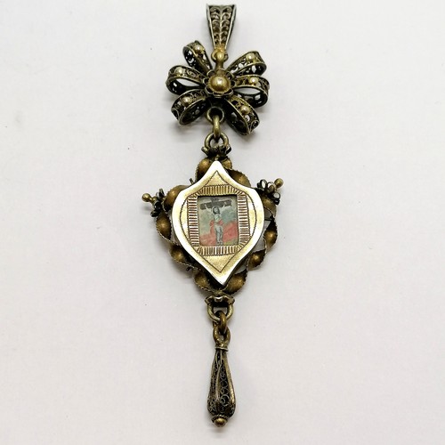 247 - Antique Swiss unmarked silver gilt religious Deli pendant with reverse glass paintings to both sides... 