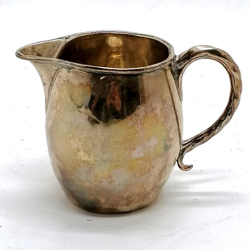 292 - Antique silver cream jug hallmarked London 1808. 90g, 8.5cm high. Has dents to the body and base