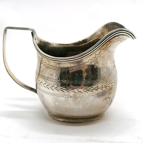 295 - Antique silver cream jug, hallmarked London 1783. 122g. 7cm high. Has dents around the base and old ... 