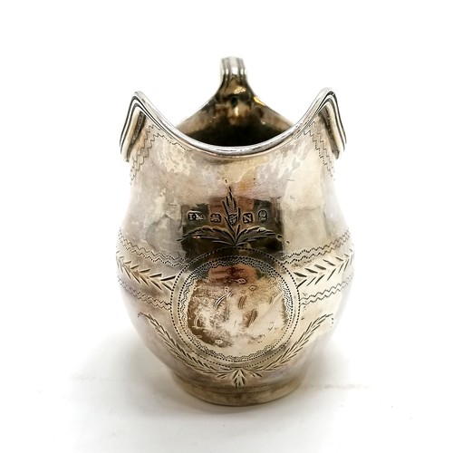 295 - Antique silver cream jug, hallmarked London 1783. 122g. 7cm high. Has dents around the base and old ... 