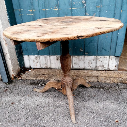 412 - Antique oak circular low pedestal table in weathered condition. 72cm diameter x 62cm high