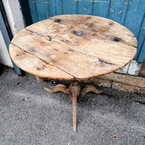 412 - Antique oak circular low pedestal table in weathered condition. 72cm diameter x 62cm high