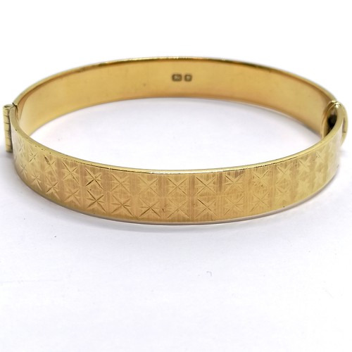 461 - Silver gilt bangle with diamond cut design by Fred Manshaw Ltd - 23.6g total weight & 6cm across