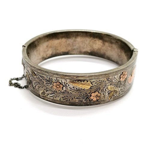 476 - Antique engraved silver bangle with unmarked gold detail by Henry Griffith & Sons Ltd - 28g total we... 