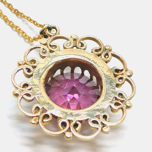 497 - Unmarked gold alexandrite pendant (3cm drop) on a gilt metal 56cm chain ~ total weight 12g - SOLD ON... 