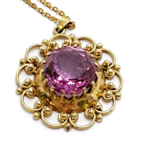 497 - Unmarked gold alexandrite pendant (3cm drop) on a gilt metal 56cm chain ~ total weight 12g - SOLD ON... 