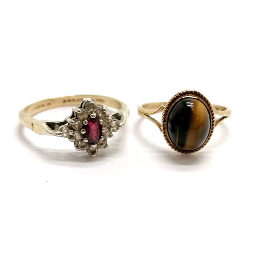 505 - 9ct hallmarked gold tigers eye ring (size N) t/w 9ct gold & silver stone set ring (size T) ~ total w... 