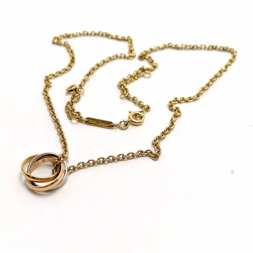 530 - Cartier 18ct marked gold 40cm chain with tri-coloured linked ring pendant (CU8568) in a Cartier box ... 