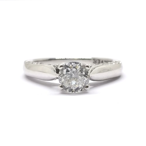 534 - Forever 18ct white gold diamond solitaire ring with diamonds set either side of the ring on the head... 