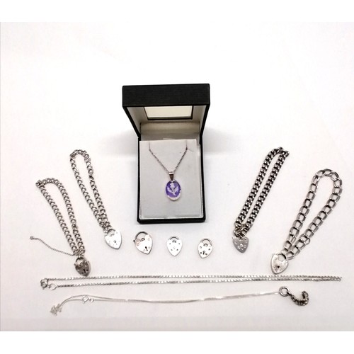 542 - Qty of silver jewellery inc curled skeletal hand pendant on chain, 4 charm type bracelets (with padl... 