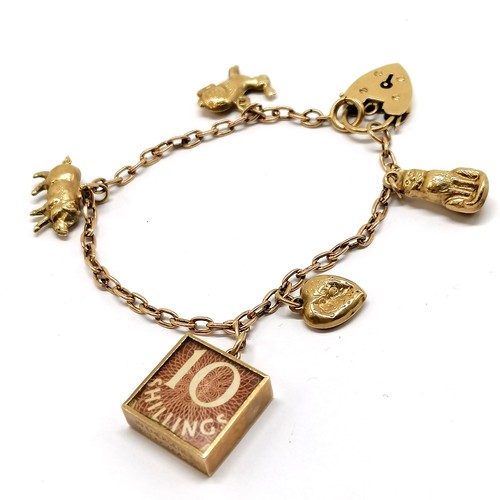 546 - 9ct hallmarked gold bracelet with padlock clasp & with Georg Jensen 10/- charm t/w 4 other charms (p... 