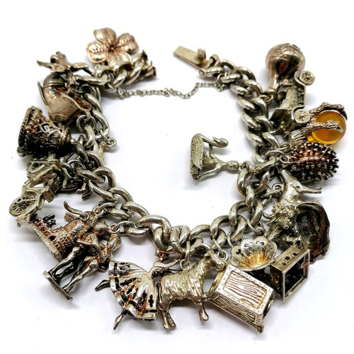 618 - Silver charm bracelet with charms inc hippocampus, seashell, motorbike etc - total weight 95g