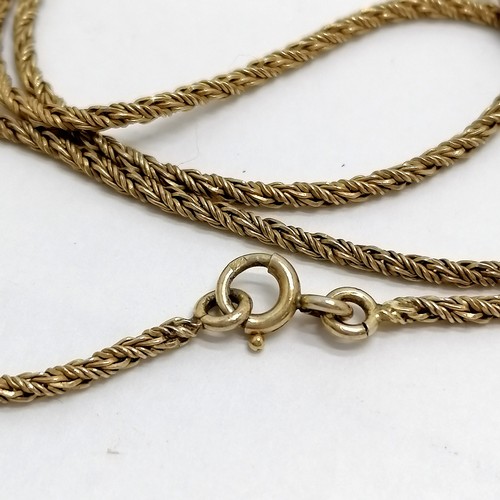 624 - Long silver gilt 120cm chain with yellow metal locket - total weight 28g