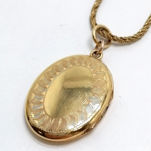 624 - Long silver gilt 120cm chain with yellow metal locket - total weight 28g