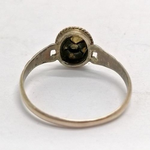 631 - Antique mourning ring in unmarked gold with blue enamel detail and cut pearls to centre in original ... 