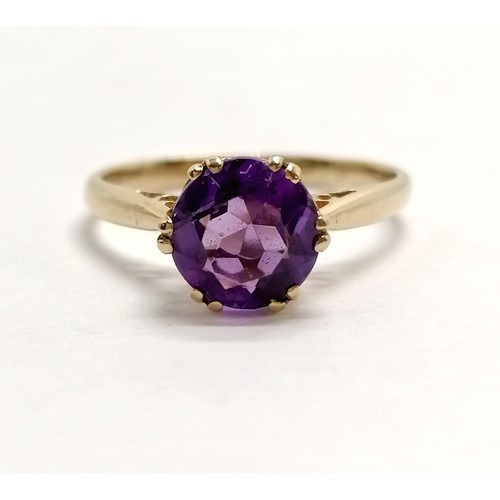 633 - Unmarked gold amethyst solitaire ring - size K½ & 1.7g total weight