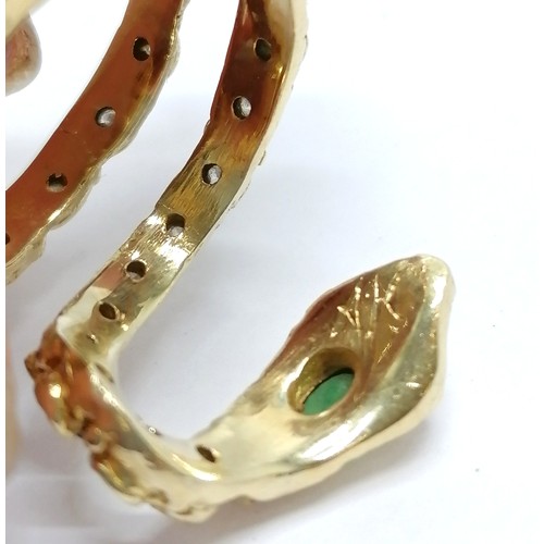 638 - Unmarked 18ct gold designer snake ring by AK set with emerald / diamonds & ruby eyes - size R & 16.4... 